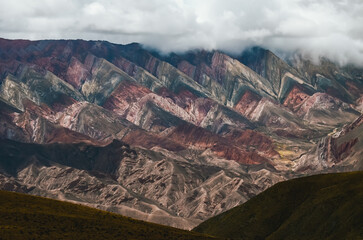 Colorful Hornocal mountain range in Jujuy under cloudy sky