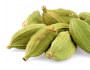 Macro close-up of vibrant green cardamom pods, showcasing sharp texture on a pure white background, ready for culinary use as an aromatic spice