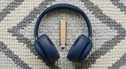 Premium Blue Over Ear Headphones and Small Wooden USB Drive on Textured Background