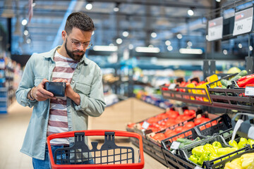 Man Shopping for Fresh Vegetables in a Grocery Store