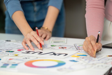 UX and UI Design Collaboration. Creative team brainstorming on user interface concepts.
