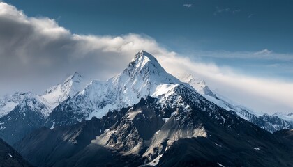 Fototapeta premium snow capped mountain viewed on cloudy day