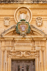 Facade and portal with main gate to 12th century St Paul's Cathedral (Mdina Cathedral), Malta, Mdina