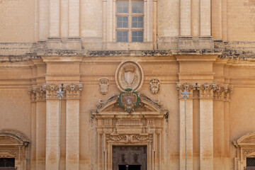 Facade and portal with main gate to 12th century St Paul's Cathedral (Mdina Cathedral), Malta, Mdina