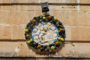 Relief with Madonna and Child on facade, catholic street shrine, Malta, Mdina