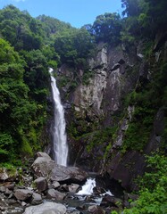 Waterfall cascading down rocky mountainside