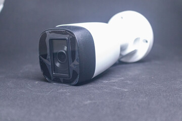 Wireless security camera with antenna on white background.