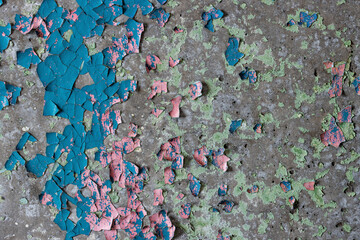 Peeling paint on the wall. Old concrete wall with cracked flaking paint. Weathered rough painted...