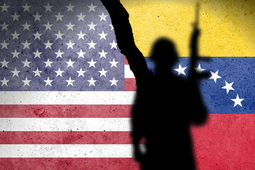 Flag of USA and Venezuela painted on a concrete wall with soldiers shadow