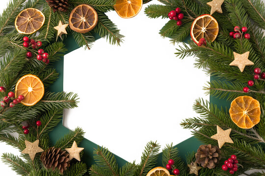 Festive Christmas holiday wreath with natural decorations like dried orange slices, red berries, and stars creating a hexagonal frame on a white background