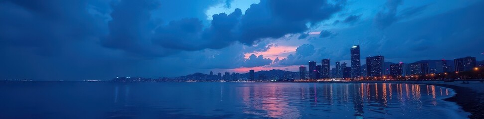 Obraz premium Dark blue sky with silhouetted cityscape and sea , barcelona, city view