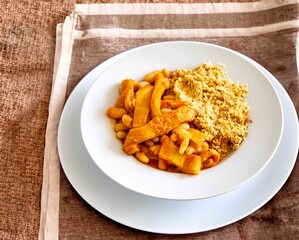 A classic Brazilian dish known as dobradinha, prepared with beef tripe, white beans, and tropical...