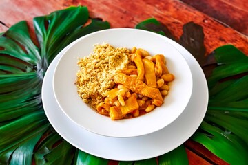 A classic Brazilian dish known as dobradinha, prepared with beef tripe, white beans, and tropical...