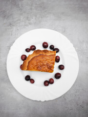 Delicious cranberry tart with fresh cranberries on white plate, celebrating fall flavors