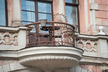 Balcony as an emblem of history and design, where ironwork patterns and stone details reflect...