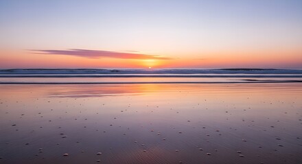 Serene ocean waves reflect a breathtaking pastel sunset on a tranquil beach, inspiring peace and calm.