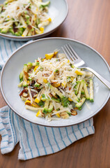 Close up of Simple Vegetarian Side with Green and Yellow Zucchini and Toasted Almonds