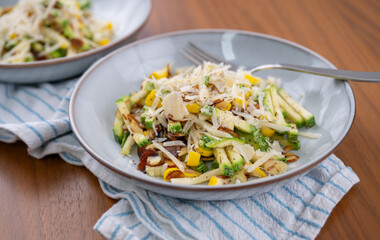 Close up of Simple Vegetarian Side with Green and Yellow Zucchini and Toasted Almonds