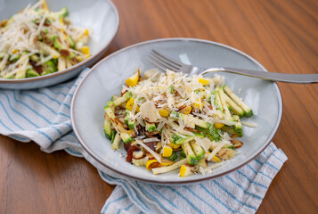 Close up of Simple Vegetarian Side with Green and Yellow Zucchini and Toasted Almonds
