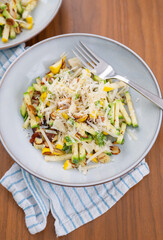 Close up of Simple Vegetarian Side with Green and Yellow Zucchini and Toasted Almonds