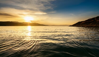 serene rippled water surface with soft reflections from golden light captured in stunning clarity for natural scenery and calm atmosphere