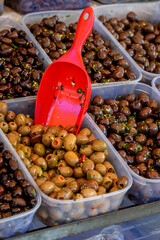 Close-Up of Green and Black Olives at Market