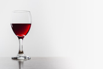 Glass of red wine with reflection