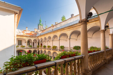 View of the Italian Courtyard in Lviv, Ukraine, with arches, columns, and flower decorations