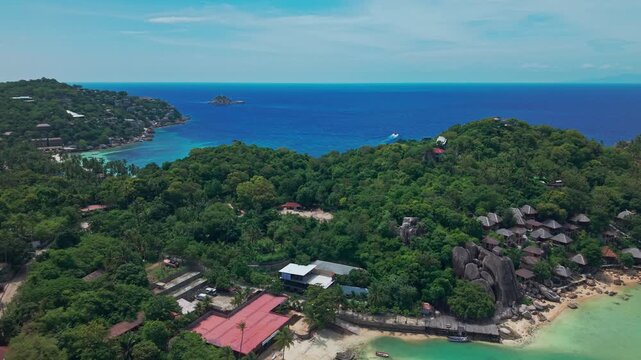  Chalok Baan Kao, Koh Tao, Thailand Aerial drone pan beach and jungle, sand blue turquoise water.