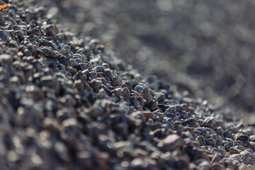 Pile of gravel forming a slope at concrete production plant