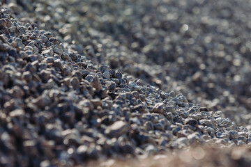 Gravel pile forming a slope in a concrete production plant
