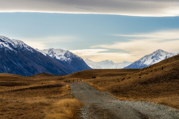 Driving up Lilybank road alongside Lake Tekapo towards the snowy Mount Cook mountain ranges