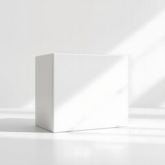 Blank white square box mockup on bright minimalist background with natural sunlight and shadows for packaging design