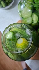  green cucumbers, pickled in glass jars, healthy food, delicious food
