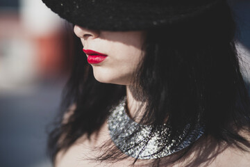 Bold fashion portrait with metallic jewelry. Sensual woman with red lipstick. Confident woman with...
