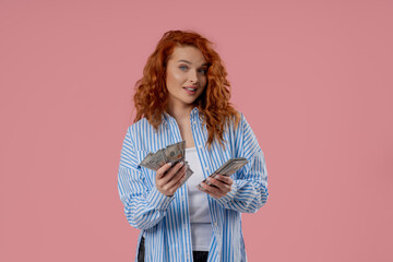 Rich Ginger Woman Counting Usd Cash Money Dollars On Pink,Income payment, salary