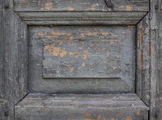 Old textured wooden panel with cracked paint
