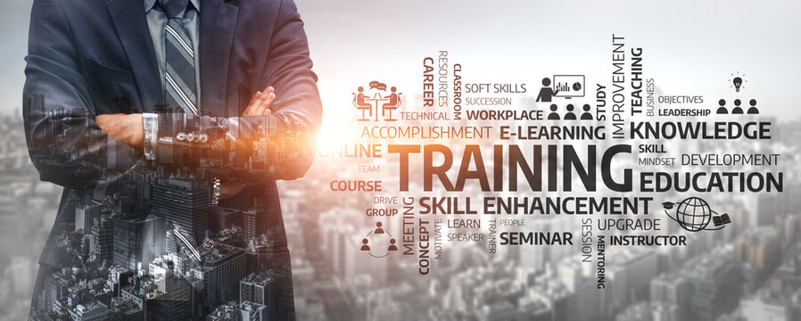 A businessman stands confidently over a city skyline, illustrating themes of training, education, and professional growth for enhanced workplace skills and success. Tessel