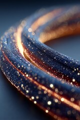 Obraz premium Close-up of a shimmering, textured fabric with glowing threads, creating a vibrant effect.