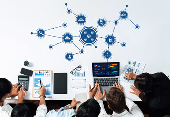 A diverse team engages in collaborative business planning, analyzing data through charts and graphs, fostering innovation and insights in a modern office environment. Amity