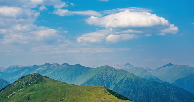 Timelapse of moving clouds over mountains. High quality 4k footage