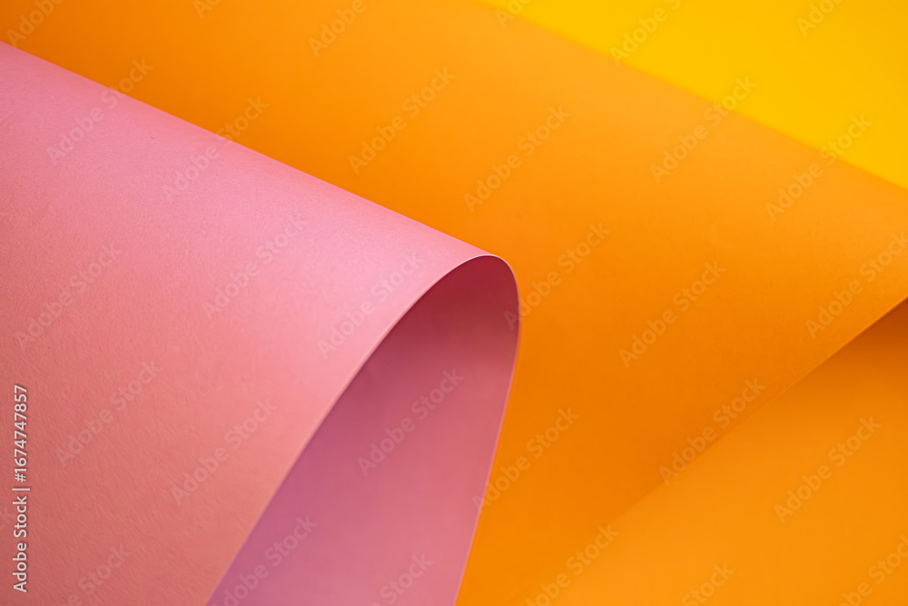 Aufkleber abstract close-up of colorful sheets of paper in pink and yellow. the curved fold creates a smooth f