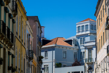 Facade of colorful homes and apartment buildings in Lisbon, Portugal.