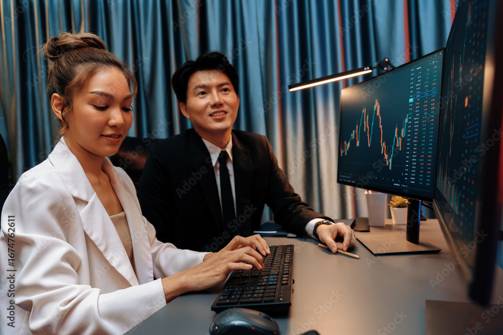 Poster smiling asian business traders pointing to dynamic stock exchange data screen profit value online we