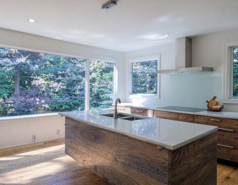 Sleek kitchen gleams with copper tones under soft morning sunlight