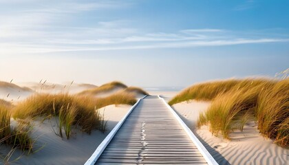 Serene wooden boardwalk winds through sunlit coastal sand dunes towards a tranquil ocean horizon.