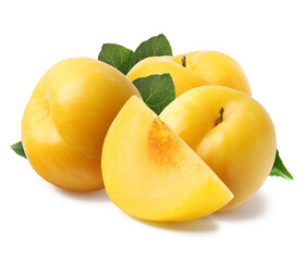 Whole and cut ripe cherry plums with green leaves isolated on white