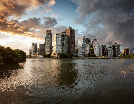 Mirror like water reflects futuristic skyline under pastel dawn hues