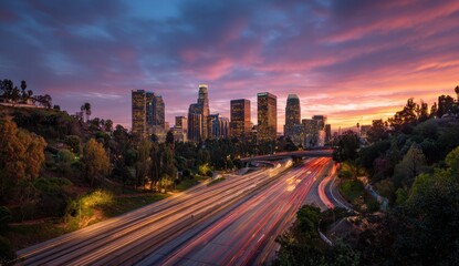Fototapeta premium City skyline at sunset over highway