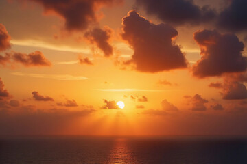 Sunset, Sky clouds over sea in the Evening with Orange, Yellow Gold sunlight sun dawn in Golden hour and Dramatic fluffy, Horizon morning sunny sunrise sea Summer sky landscape, Dusk sky background.